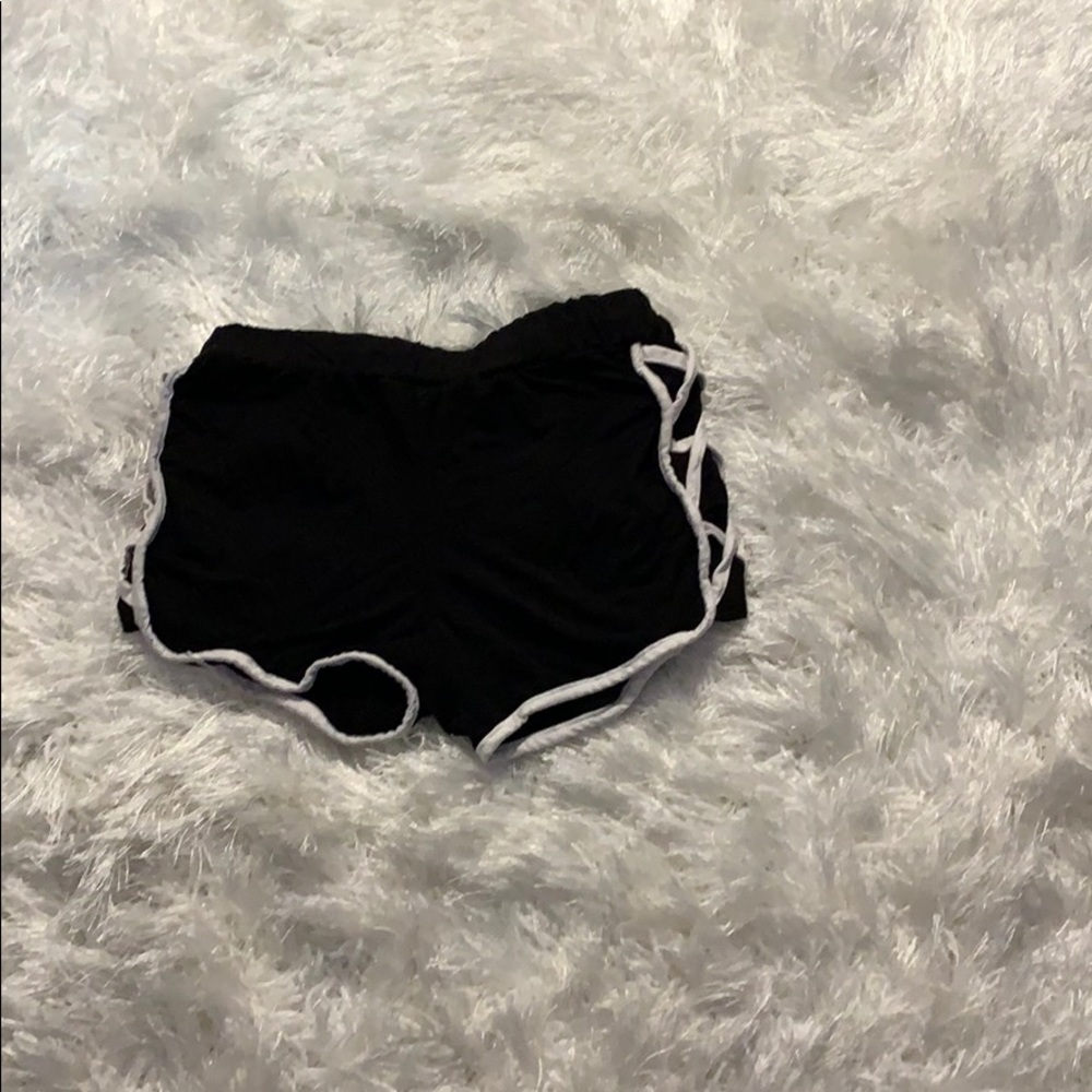 a pair of black and white lesters shorts